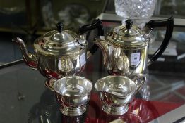 A plated four piece tea service.