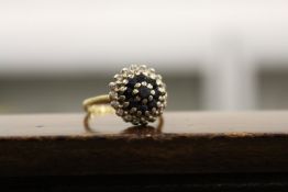 A good gold, diamond and sapphire cluster ring.