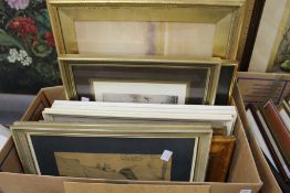 A box of paintings and prints.