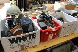 A quantity of cameras and camera equipment.