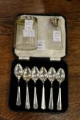 A cased set of six silver coffee spoons and two silver mounted cut glass jars.
