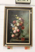 A still life of flowers in a vase on a ledge, oil on canvas.