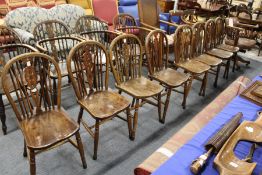 A SET OF EIGHT EARLY 20TH CENTURY BEECH AND ELM WHEELBACK DINING CHAIRS. 3ft 0ins high x 1ft 3ins