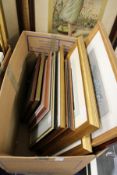 A box of assorted paintings and prints.