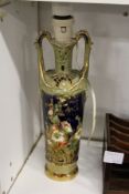 A continental twin handled vase converted to a lamp.