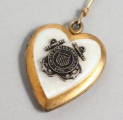 A decorative gilt metal and mother-of-pearl pendant and chain.