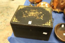 A 19th century black lacquer and gilt decorated tea canister with engraved pewter liner.