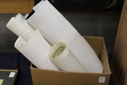 Various unframed posters.