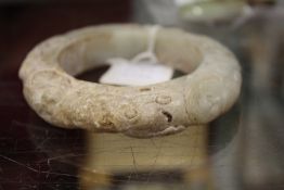 A large Chinese carved jade bangle.
