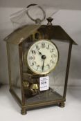 A small brass case clock.
