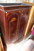 An Edwardian inlaid mahogany wardrobe.