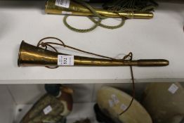 A brass hunting horn.
