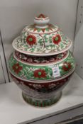 An early 20th century Chinese Ming style iron red and green ground porcelain jar and cover (rim