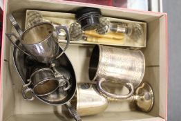 An engraved silver christening mug, silver goblet and other small silver items.