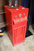 A Victorian style post box with stand.