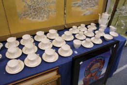 A large quantity of Spode Delphi tea cups and saucers with matching coffee cups, coffee pot, milk