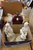 Two Parian style figures, decorative lamps and a tray.