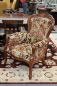 A pair of Victorian style upholstered armchairs.