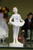 A Royal Doulton figure of a ballerina.