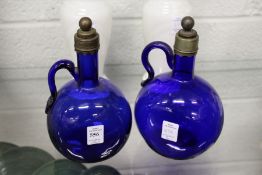 A pair of continental blue glass wine ewers.
