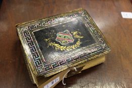 A small Victorian lacquer photograph album.