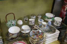 A collection of small porcelain items to include Port Meirion bowl, golfing cup and saucer etc.