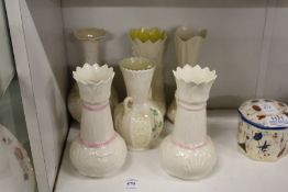 A collection of Belleek porcelain vases.