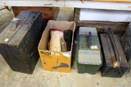 A quantity of tool boxes and tools.