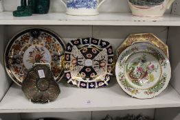A small group of decorative plates and a moulded glass dish.