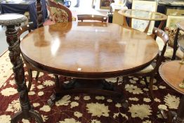 A good Georgian style mahogany circular breakfast table on three reeded curving columns, the