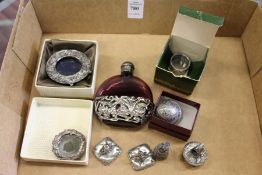 A decorative scent bottle, miniature picture frame and other ornamental items.