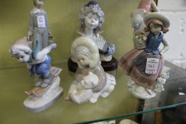 Two Lladro figures of a child and a polar bear cub, a young girl with a basket of flowers together