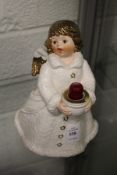 A Goebel candle holder modelled as an angel holding a bowl.