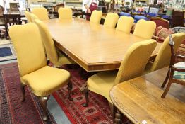 A good set of twelve upholstered dining chairs on carved cabriole legs.