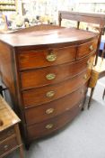 A large Victorian mahogany bow front chest of drawers.