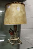 A Goebel table lamp modelled as a kingfisher on a tree stump.