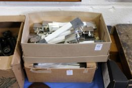 A quantity of door handles.