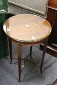 An Edwardian inlaid mahogany mahogany circular occasional table.