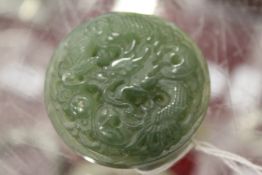 A Chinese carved jade buckle.
