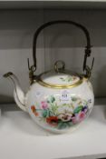 A floral decorated teapot.