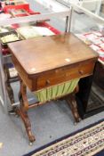 A Victorian walnut work table.