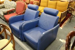 A good pair of Heal's blue leather upholstered reclining armchairs.