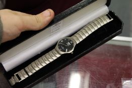 An Adidas wristwatch.