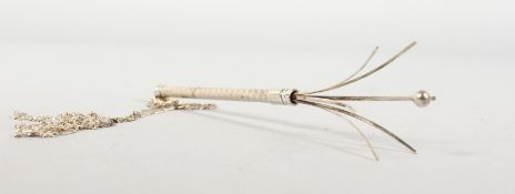 A silver swizzle stick.