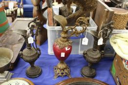 A pair of classical ewers and a similar ewer.