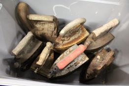 Seven old box irons.