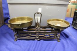 An ornate cast iron and brass scales.