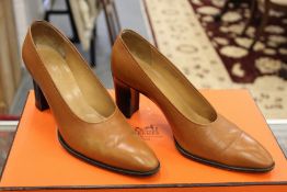 A pair of Hermes small heeled pumps, leather shoes complete with dust bag and original box.