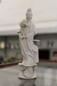 A small Chinese blanc-de-chine figure of Guanyin.