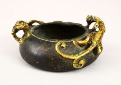 A 20TH CENTURY CHINESE BRONZE TWIN HANDLE CENSER, the censer with moulded gilded handles in the form